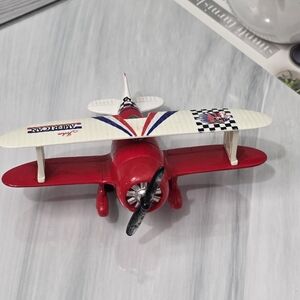 Red and White Toy Biplane